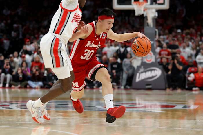Feb 29, 2024; Columbus, Ohio, USA; Nebraska Cornhuskers guard Keisei Tominaga (30) dribbles past Ohio State Buckeyes guard Dale Bonner (4) during the first half at Value City Arena.